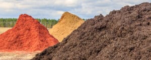 Mounds of red, gold, and brown mulch
