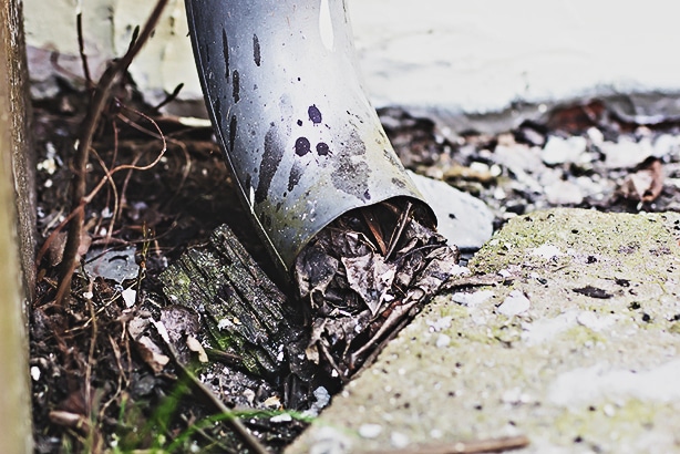 Gutters with drainage problem can cause mud-filled lawns.