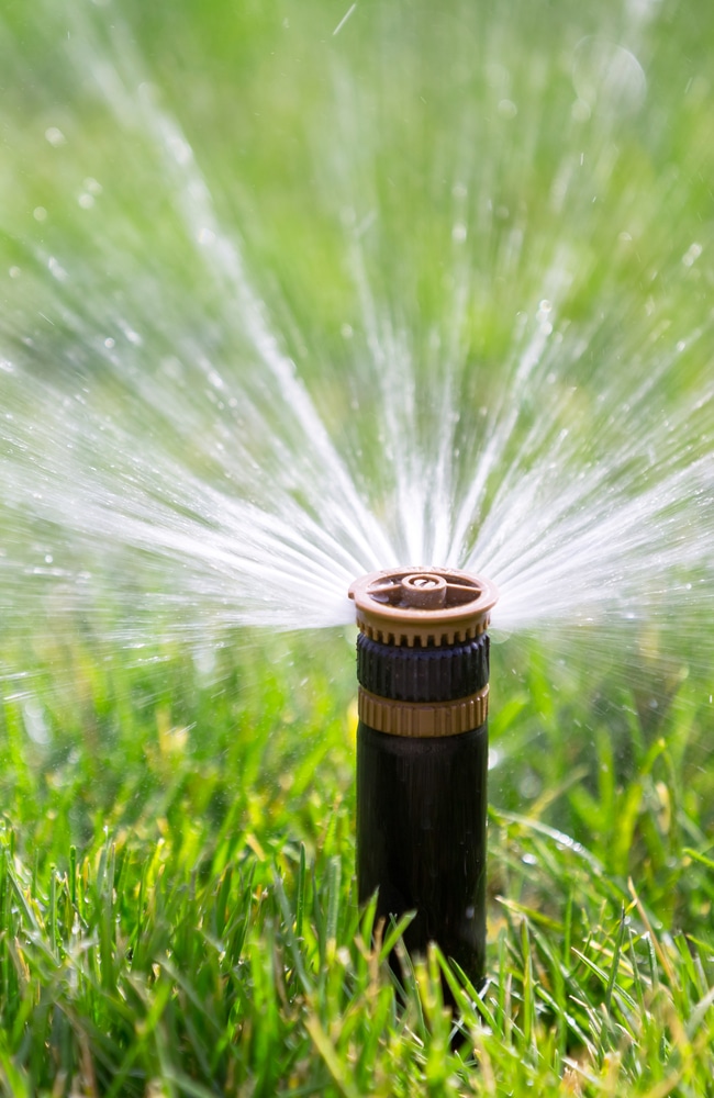 The sprinkler head sprays water in a 150 degrees radius